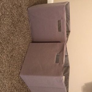 2 medium-large sized gray storage/drawers